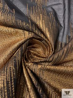 the fabric is metallic and gold