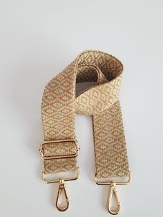 "Boho style, purse or bag strap. This guitar style adjustable strap makes a stylish addition to a boring purse. Easy to clip on any purse or bag. This can also be used crossbody. This is made out of 2 inch wide woven webbing that is beige and deep golden mustard colors. Attached is a antiqued brass, antiqued bronze, silver or gunmetal  lobster clasp. This strap can be adjusted from 31\"-55\", including the hardware. These make wonderful, unique gifts. Contact me for custom lengths. Take a peak a Chic Adjustable Shoulder Strap For Travel, Gold Bag Strap For Everyday Use With Long Strap, Beige Logo Strap Bag Strap For Daily Use, Adjustable Chic Bag Strap For Travel, Chic Adjustable Bag Strap For Travel, Gold Crossbody Shoulder Strap For Everyday Use, Trendy Beige Bag Strap For Everyday Use, Casual Everyday Shoulder Strap With Detachable Feature, Casual Beige Bag Strap For Daily Use