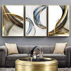 The 'Dynamic Elegance' framed art set is a symphony of fluid motion and metallic grace. Capturing the essence of movement with sweeping golden and silver lines over a neutral palette, this trio of abstract art is a sophisticated addition to any modern space. Each piece, encased in a sleek aluminum frame with shatterproof glass, is printed using UV technology for a lasting impression. These artworks are designed to bring a vibrant yet refined energy to your home or office, perfect for creating an Modern Apartment Living Room, Modern Appartement, Nordic Wall Art, Living Room Pictures, Modern Apartment, Apartment Living Room, Room Wall Decor, Wall Spaces, Apartment Living