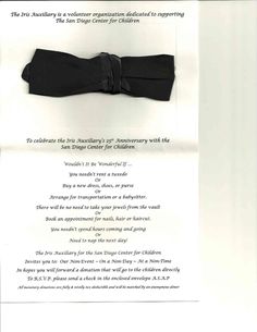 a black bow tie on display in a white frame