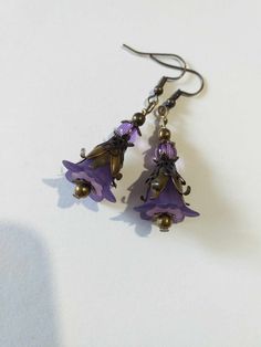 Purple Victorian bronze flower earrings lavender flower set necklace earrings Purple flower earrings Boho bronze earrings gift Gorgeous Victorian style jewelry set necklace and earrings . Bohemian necklace and earrings . Beautiful Set of bronze-tone Antique style lavender purple plastic flowers  and beautiful ornamented caps necklace and earrings. Bronze Victorian style necklace and earrings. Boho necklace. Bohemian necklace and earrings. Romantic necklace and earrings. Royal style jewelry set. Baroque style jewelry set. Antique style jewelry set. Gothic style jewelry set.  Perfect Gift for girlfriend,  mother,  sister,  bridesmaids or Maid of honor. Gift for special people or jewelry set for your special occasion. You may choose from the options menu from: earrings,  jewelry set necklace Bohemian Metal Jewelry With Flower Charm, Handmade Purple Metal Earrings, Purple Brass Earrings As Gift, Handmade Metal Flower Jewelry, Bohemian Wire Wrapped Flower Jewelry, Bronze Brass Flower Earrings For Gift, Bronze Brass Flower Earrings As Gift, Purple Flower-shaped Nickel-free Jewelry, Bohemian Copper Flower Earrings As Gift