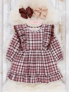 Twirl in style with our Brown Plaid Ruffle Dress! This adorable girls dress features a charming ruffle detail and a trendy brown plaid pattern. Perfect for autumn, it also comes in a sister set. Strike a pose and make a statement with this playful and fun dress! Fits true to size. 95% Polyester / 5% Spandex 97% Cotton / 3% Spandex Accessories sold separately. Suggest bow color #45 and #49 Import *Afterpay and Sezzle Purchase Requires $35 Minimum Order. Xxxl Dress, Dresses Winter, Fun Dress, Dresses Xxl, Baby Dresses, Brown Plaid, Strike A Pose, Girls Dress, Winter Dresses