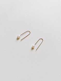 + PEARL U HOOP THREADER EARRINGS +Tiny Fresh Water pearl threader in U shape made with 14k Gold-filled wires. A small drop dangle on your ears that are modern & classic. + Fresh water pearls 4mm+ 14k Gold-filled wire+ Listing is for 1 pair of earrings+ Please allow 5-7 business days to ship out. Minimalist Everyday Pearl Earrings, Minimalist Pearl Earrings For Everyday, Minimalist 14k Gold Filled Threader Earrings, Minimalist Pearl Drop Earrings For Everyday, Everyday 14k Gold Filled Pearl Earrings With Ear Wire, Everyday White Threader Earrings, Adjustable Minimalist Threader Earrings For Everyday, Minimalist 14k Gold Dangle Pearl Earrings, Minimalist Pearl Earrings With Ear Wire