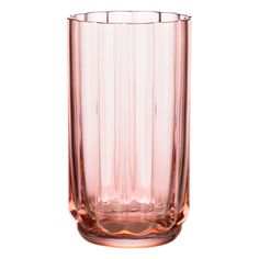 a pink glass vase sitting on top of a white table