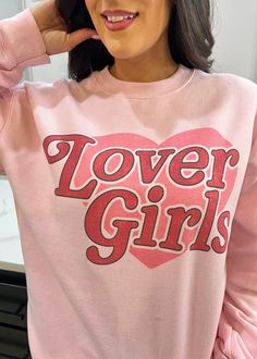 "Lover Girls" Pink Graphic Sweatshirt Red Heart on a Pink Sweatshirt Long Sleeve Slightly Oversized Oversized Long Sleeve Top With Heart Graphic, Oversized Heart Print Casual Tops, Casual Oversized Heart Print Tops, Cute Oversized Slogan Sweatshirt, Pink Long Sleeve Slogan Top, Pink Long Sleeve Top With Slogan, Valentine's Day Slogan Crew Neck Top, Valentine's Day Slogan Top With Crew Neck, Cute Pink Sweatshirt With Text Print