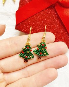 Cute tiny Christmas Tree earrings great for the holiday season! Made with Czech glass seed beads. Earring wire is Nickel-free | Mini Christmas Tree Earrings, Christmas Tree Earrings, Stocking Stuffers For Women, Christmas Jewelry, Holiday Gifts For Mom, Gifts Under 10 Christmas Beading, Big Christmas Tree, Beading Designs, Crochet Jewellery, Native Beading Patterns, Beaded Stuff, Stocking Stuffers For Women, Holiday Beading, Unique Handmade Earrings