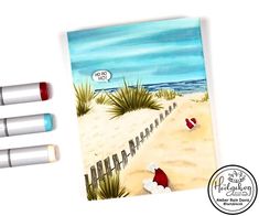 three markers are next to an illustration of santa claus on the beach with his feet in the sand