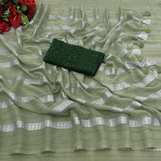 Green colored saree is made from georgette fabric which is highlighted with beautiful zari weaving striped pattern as shown. comes along with unstitched sequins embroidered net blouse which you can customise as per your design/style. Occasion - You can wear this saree for festive and functions, outing and get-together. Note:- the actual product may differ slightly in color and design from the one illustrated in the images when compared with computer or mobile screen. Measurements: Saree : George Green Chiffon Saree With Dupatta, Traditional Green Chiffon Saree, Pista Green Georgette Blouse Piece With Mirror Work, Chiffon Saree With Self Design In Traditional Drape, Green Chiffon Saree With Unstitched Blouse, Elegant Pista Green Saree With Mirror Work, Festival Pista Green Saree With Mirror Work, Pista Green Unstitched Saree With Mirror Work, Unstitched Pista Green Saree With Mirror Work