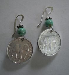 Who doesn't love elephants? The elephant coins are real coins from Somalia and are aluminum, making the earrings light in weight. Sterling silver ear wires and accent beads (accent beads and coins may vary), and your choice of stone beads. E460 Elephant. Gift boxed and free shipping. Nickel Free Coin Shaped Sterling Silver Earrings, Nickel Free Sterling Silver Coin Earrings, Nickel Free Coin-shaped Sterling Silver Earrings, Nickel-free Sterling Silver Coin Earrings, Nickel-free Coin-shaped Sterling Silver Earrings, Coin Crafts, Diy Jewelry Earrings, Coin Earrings, Assemblage Jewelry