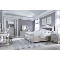 a bedroom with gray walls and furniture in the room, including a bed, dresser, mirror