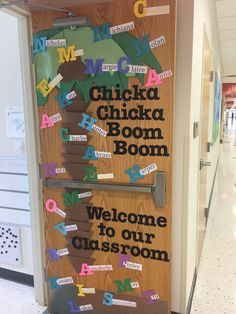 a door with the words welcome to our classroom written on it in different languages and letters