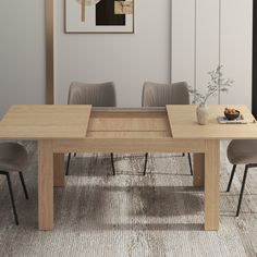 a dining room table with four chairs and a painting hanging on the wall behind it