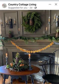 an image of a fireplace decorated with pine cones and wreaths on the mantel