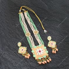 This is a stunning handmade necklace perfect for high end Jewelry Collector, a keeper in Traditional Vintage Indian/Pakistani Bridal jewelry and a Luxury Gift for your Daughter, Sister or Wife on Wedding or Anniversary. Perfect for any type of occasions, weddings And celebrations and a beautiful & memorable gift for weddings and special occasions. - Item Code:- L -Aqua green & peach beaded Necklace Set with Earrings. -Designer multi layered faceted peach & green beaded necklace. -Gold Plated Set with Kundan Stones which shine like Polki Diamonds. -Metal: Gold plated brass -Earrings are 95mm long & 45mm wide approx -Push Back Earrings -Necklace length with pendant 11.5" approx including adjustable dori/cord -Quantity - One Necklace Set Please see more different designs here:- https://www.et Luxury Meenakari Bridal Necklace Pendant, Luxury Meenakari Beaded Bridal Necklace, Luxury Bridal Meenakari Pendant Necklace, Luxury Meenakari Pendant Bridal Necklace, Pakistani Bridal Jewelry, Kundan Necklace Set, Vert Turquoise, Green Beaded Necklace, Polki Necklace