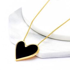 Embrace Eternal Love with the Juliet Enamel Heart Necklace! Unlock the doors to timeless romance with our Juliet Enamel Heart Necklace. This exquisite piece is a testament to enduring love, featuring a heart of enamel that symbolizes a love that knows no bounds. Its simple yet elegant design will effortlessly become your signature accessory, elevating your style for any occasion. Key Features: Premium Craftsmanship: Crafted from high-quality enamel and plated with gold, this necklace boasts a st Valentine's Day Enamel Heart Pendant Necklace, Enamel Necklaces For Anniversary On Valentine's Day, Elegant Enamel Heart Pendant Necklace, Valentine's Day Gold Enamel Heart Necklace, Elegant Heart Pendant Enamel Necklace, Gold Heart-shaped Enamel Necklace, Heart-shaped Gold Enamel Necklace, Elegant Enamel Necklace For Valentine's Day, Gold Enamel Heart Necklace For Valentine's Day