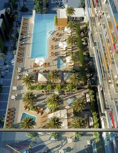 an aerial view of the pool and surrounding buildings