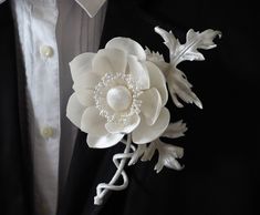 This silk anemone boutonniere features an ivory satin flover with serrated velvet leaves and decorative stems. The silk anemone buttonhole makes a perfect addition to a groom's outfit. And UNLIKE a buttonhole with a real flower it will never wilt ☺ It makes a great keepsake of your important day, too. The ivory silk flower boutonniere is finished with a brooch pin for easy attachment (see the photos). The ivory anemone flower is made of cherry picked fabrics that have been stiffened and hand sha Anemone Buttonhole, Anemone Boutonniere, Silk Flower Boutonniere, Groom Buttonholes, Velvet Leaves, Flower Boutonniere, Velvet Flower, Anemone Flower, Velvet Flowers