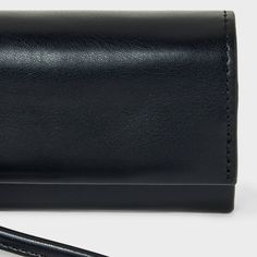 Keep your essentials close at hand and neatly organized with this Mini Wristlet Wallet from A New Day™. This wristlet wallet features a magnetic closure, a coin purse and credit card pockets to easily accommodate loose change, cash, credit cards, IDs and other essential items. Plus, it has a removable loop strap so the wallet can be worn around your wrist or carried in hand as a clutch. A New Day™: Style that goes wherever you do. Business Clutch With Cell Phone Pocket, Rectangular Business Clutch With Cell Phone Pocket, Modern Rectangular Wallet On Chain For Business, Modern Business Wallet On Chain, Modern Crossbody Wallet For Evening, Formal Clutch With Card Slots, Modern Evening Crossbody Wallet, Daily Use Rectangular Wallet On Chain With Removable Pouch, Classic Compact Wallet For Daily Use