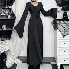 Indulge in the mysterious elegance of our Gothic Witch Long Sleeve Maxi Dress. Featuring flattering ruched details and a v-neckline that accentuates your curves, this dress exudes sophistication. The long bell sleeves and ankle-length design add drama, making it perfect for Halloween or any special occasion. Crafted from a luxurious polyester and spandex blend in a rich black hue, this dress pays homage to the iconic Addams Family, allowing you to embrace your inner enchantress in style. Ruched details and v-neck for a flattering fit Long bell sleeves for dramatic flair Ankle-length design for elegant sophistication Luxurious polyester and spandex blend Rich black color inspired by the Addams Family Kawaii Socks, Gothic Witch, Long Bell Sleeves, Addams Family, Sleeve Maxi Dress, Long Sleeve Maxi, Short Socks, Headband Hairstyles, Hair Accessories Headbands