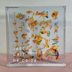 an acrylic glass block that has been designed to look like colorful pieces of art