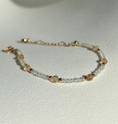 Joy * Positivity * Abundance  - 2mm Citrine beads  - 4mm Citrine beads  - Gold plated  - +2in adjustable chain  Please don't hesitate to contact me if you have any questions!  ☺️ Illuminate your path with our citrine bracelet, a radiant beacon of warmth and optimism. Known for its vibrant golden hues and energizing properties, citrine helps unlock your inner abundance and creativity. Wear this luminous bracelet as a talisman to attract positivity, boost your confidence, and celebrate the joy tha Dainty Adjustable Gold Beaded Bracelets, Adjustable Gold Crystal Bracelet With Spiritual Style, Adjustable Gold Crystal Bracelet Spiritual Style, Adjustable Gold Spiritual Crystal Bracelet, Gold Beaded Bracelets With Gemstone Beads, Adjustable Gold Beaded Bracelets With Gemstone, Gold Gemstone Beaded Bracelets In 14k Gold Filled, Delicate Adjustable Gold Beads Bracelet, Adjustable Yellow Crystal Bracelet With Gemstone Beads