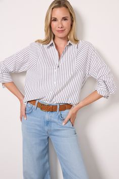 Contrasting stripes add a fun detail to this elevated button-down by EVEREVE. Crafted in sustainable stretch cotton, this shirt features a classic collar, a curved hem, and a relaxed silhouette. Trendy Striped Workwear Shirt, Vertical Stripes Button-up Business Casual Shirt, Classic Striped Blouse With Relaxed Fit, Vertical Stripes Button-up Shirt For Business Casual, Business Casual Vertical Stripes Button-up Shirt, Business Casual Button-up Shirt With Vertical Stripes, Fall Daywear Shirt With Striped Collar, Fall Season Striped Collar Shirt For Daywear, Classic Relaxed Fit Blouse With Vertical Stripes