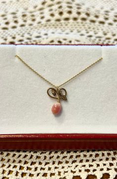 "This delicate late Victorian-era (circa 1900) pendant depicts a pair of deeply engraved leaves with looping stems, below which is the most delectable fruit: a precious conch pearl. The pearl has been certified by the GIA to be a natural and untreated saltwater conch pearl that is oval in shape and pink in color. The pearl measures 4.76 x 4.05 mm. The conch pearl exhibits a subtle \"flame structure,\" which is the distinctive pattern sometimes seen on conch pearls and a highly desirable quality Elegant Teardrop Pendant Charms Jewelry, Victorian Pearl Pendant Necklace Gift, Vintage Yellow Gold Pearl Necklace Gift, Vintage Yellow Gold Pearl Necklace As Gift, Elegant Teardrop Pendant Necklace With Charms, Elegant Pearl Pendant Necklace With Charms, Elegant Engraved Teardrop Pendant Jewelry, Vintage Pear-shaped Pearl Drop Jewelry, Pear-shaped Pearl Pendant Necklace As Gift