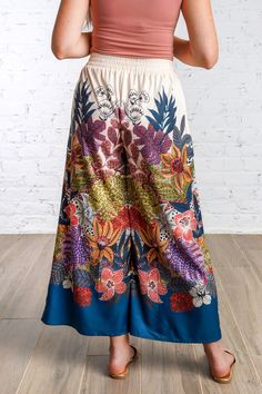 Elevate your wardrobe with the Flora Vista Pants. Featuring a vibrant botanical print of deep greens, blues, mustards, pinks and cream, these pants are perfect for everyday casual style. With a comfortable elastic waistband, side pockets and a chic cropped flare silhouette, experience effortless style and comfort in one. Fits true to size. No lining. Light weight. Non sheer. Stretch and elastic at waist. 100% Polyester Model is 5'8" and wearing a small. Brand - Umgee Green Bottoms With Vibrant Print For Vacation, Casual Multicolor Floral Print Pants, Casual Wide Leg Floral Print Pants, Vacation Floral Print Wide Leg Pants, Spring Printed Rayon Bottoms, Summer Multicolor Floral Wide Leg Pants, Multicolor Wide-leg Pants With Elastic Waistband, Printed Rayon Wide-leg Pants, Printed Wide-leg Rayon Bottoms