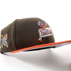 a baseball cap with an orange brimmed visor