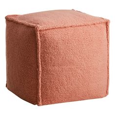 a small square poufce with a pink color on the top and bottom part