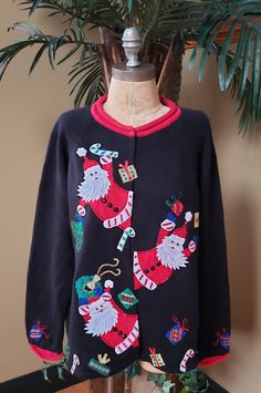 Beautiful vintage Christmas cardigan by TIARA INTERNATIONAL ! Featuring Santa Clause! Hidden buttons 55% Ramie 45% Cotton So FUN and perfect for the Holiday season :) This gem has been laundered on gentle and air dried, so it is ready to wear :)    This sweater is labeled a size large. I typically prefer a large in sweaters, sometimes a medium/large and this sweater fits me nicely and is plenty roomy. My best opinion is that it would up to a size large.  However, please use the measurements belo Christmas Cardigan, Sweater Fits, Santa Clause, Black Plaid, Christmas Sweater, Ugly Christmas, Cardigans For Women, Red Green, Vintage Christmas