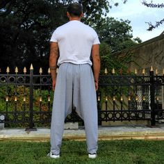 This listing is for our men's winter harem pants on sale. As we're preparing for summer, we'll be clearing up our winter stocks to provide space for summer harem pants. You can enjoy free shipping + discount on these beloved winter harem pants. Made from thick cotton fabric with lycra in gray color, and elastic waist these harem pants can fit to most sizes. These drop crotch pants caters to all men and women who look for effortless chich & comfort. They have urban style with a nice drop crot Gray Relaxed Fit Full-length Parachute Pants, Gray Baggy Tapered Leg Pants, Gray Baggy Pants With Elastic Waistband, Baggy Gray Pants For Loungewear, Gray Baggy Pants For Loungewear, Gray Harem Pants With Elastic Waistband, Gray Cotton Harem Pants With Elastic Waistband, Baggy Gray Long Pants, Gray Relaxed Fit Cotton Harem Pants