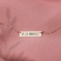 "Create a unique, timeless piece of jewelry that speaks to your personal story with our personalized roman numerals bar necklace. Available in silver, gold, and rose gold to match any outfit or style preference, it's the perfect meaningful gift for yourself or someone special in your life. It can be custom-engraved with special dates or numbers so you can carry the memories of significant events close to your heart. This skinny bar necklace is elegant yet understated, making it an easy addition to regular looks or something more sophisticated. Don't just celebrate important dates with a card; give your loved ones a charming way to remember each milestone. With its modern roman numerals, this necklace stands out with classic appeal that will remain a favorite for years. A must-have accessor Anniversay Gifts, Birthday Date, Secret Number, Number Necklace, Necklace Stand, Birthday Dates, Golden Jewelry, Monogram Jewelry, Stylish Necklace