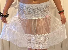 "Beautiful skirt, petticoat, underskirt ,  pure white soft lace and soft net material, very comfortable skirt, light weight  stretch elasticated waist band and finishing with tier of lace fabric and tier of net fabric and beautiful pink bows.  Waist size 26\" to 40\" inches  26\"-28\" inches (S) Length 16\" 30\"-32\" inches (M)Length 18\" 34\"-36\" inches (L) Length 20\" 38\"-40\" inches (XL) Length 22\"  Please check the waist size and the length before you order. please contact me if you have White Fitted Lace Mini Skirt, Fitted Sheer Mini Skirt For Party, Fitted Sheer Dress With Skirt, White Summer Party Petticoat, White Ruffled Mini Skirt For Party, White Ruffled Skirt Petticoat, Party Skirted Stretch Petticoat, Fitted Mini-length Petticoat For Summer, Fitted Mini Length Petticoat For Summer