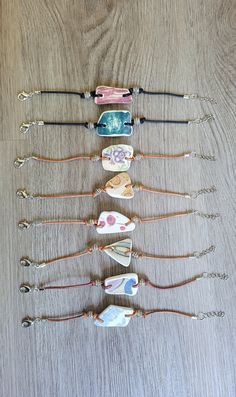 five different bracelets are lined up on a table