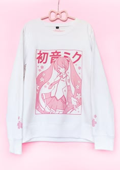 A pastel pink Sakura Miku Sweater, with a Yume Kawaii vibe!  Sweater color and design placement is most accurate to the 2nd picture!!  Printed via Direct-to-Garment method for a matte finish that blends well with the fabric without excess edges. American sizing! Size chart on the last image. ❤ 50% pre-shrunk cotton, 50% polyester ❤ Air-jet spun yarn with a soft feel and reduced pilling ❤ Lined with fleece inside for a soft texture  ❤ Double-needle stitched collar, shoulders, armholes, cuffs, and Nun Clothes, Kawaii Fairycore, Sakura Miku, Kawaii Sweater, Yume Kawaii, Miku Cosplay, Mode Kawaii, Kawaii Shirts, Hoodie Cute