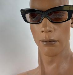 Vintage 1960'S Sci Fi Sunglasses in a sixties futuristic style, very thick cyber sci fi Frames.. these are Unisex, so both guys and gals can wear them.... These frames are so fun & funky! Kinda Mod, kinda Sci Fi... on the stem is printed: MADE IN FRANCE These were made as fashion sunglasses in the 1960's from France.. and are Used but in EXCELLENT VINTAGE CONDITION. There is gold coloring along the front of the frames, stronger color on the right side where the left side seems rather faded. Retro Sunglasses With Gradient Lenses For Evening, Retro Evening Sunglasses With Gradient Lenses, Retro Cat Eye Sunglasses With Mirrored Lenses For Party, Retro Cat Eye Sunglasses With Glass Material, Retro Glass Sunglasses For Parties, Retro Cat Eye Sunglasses For Parties, Retro Glass Sunglasses For Party, Retro Party Sunglasses With Glass Lenses, Retro Anti-reflective Cat Eye Sunglasses