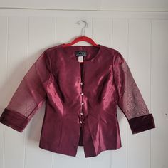 This is a vintage, Alex Petite Evenings, burgundy, evening or formal, jacket or blazer, with sheer, 3/4 sleeves and rhinestone buttons. This has shoulder pads. It is a size small petite. Pease refer to the measurements below for a proper fit. All sales are final.  The measurements are as follows: (all measurements taken flat)   Shoulder to shoulder: 15.25 inches  Armpits: 19 inches Waist: 15.25 inches  Sleeve Length from shoulder: 17.25 inches Length: 21.5  inches (from back of the neck)  If you have a wish list or are looking for something specific, please ask. I may have exactly what you are looking for.  As always please convo me with any questions or concerns regarding this item or with any international shipping questions. Unfortunately I do not accept returns or grant refunds. All sh Elegant Fitted Burgundy Blazer, Elegant Burgundy Blazer For Party, Elegant Burgundy Party Blazer, Elegant 3/4 Sleeve Evening Outerwear, Elegant Evening Outerwear With 3/4 Sleeves, Elegant Burgundy Outerwear For Party, Elegant Burgundy Party Outerwear, Elegant 3/4 Sleeve Blazer For Formal Occasions, Burgundy Long Sleeve Outerwear For Party