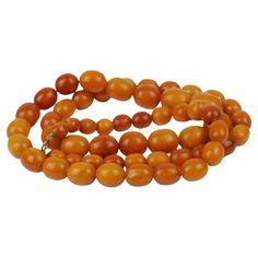 Antique 14K Gold Beeswax Amber Bead Necklace Antique Strand of Graduating Beeswax Amber beads with a 14K Gold clasp. Circa: 1920 Approximate Dimensions: 41.28 cm (Clasped/Doubled Length) x 83.8 cm (Unclasped Length) 21.25 x 17.10 mm 10.7 x 8.88 mm (Smallest Bead) 78 grams in weight Amber Bead Necklace, Amber Beads, Amber, Beaded Necklace, Jewelry Necklaces, Beads, Gold