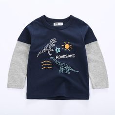 Toddler Boys Dinosaur Printed Long Sleeve Top Wholesale Boys Clothing - PrettyKid Casual Dinosaur Print Tops For Playwear, Blue Dinosaur Print Long Sleeve Top, Casual Tops With Dinosaur Print For Playwear, Cotton Long Sleeve Tops With Dinosaur Print, Long Sleeve Cotton Tops With Dinosaur Print, Long Sleeve Cotton Top With Dinosaur Print, Blue Long Sleeve Dinosaur Print Top, Casual Blue Top With Dinosaur Print, Long Sleeve Blue Top With Dinosaur Print