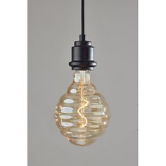 a light bulb that is hanging from a black wire and has some lights on it