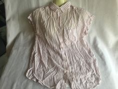 "Lightweight sleeveless striped cotton top. By American Eagle Outfitters, made of 53% cotton, 47% Viscose. Striped tan and white pattern, size XS. Is virtually sleeveless but has a little frill of a cap sleeve. Measures about 21\" across middle. Please take a look at my storefront at: https://www.etsy.com/shop/FabFinds42?ref=seller-platform-mcnav I have a wide selection of one-of-a-kind items, from clothing and toys to home decor and gift items, and I add new things almost every day." Striped Tank Top Vest, Striped Sleeveless Vest Top, Striped Tank Top With Vest Detail, Casual Sleeveless Top With Vertical Stripes, Sleeveless Cotton Blouse For Spring, Cotton Tops With Vertical Stripes For Daywear, Cotton Sleeveless Blouse For Spring, Sleeveless Cotton Shirt For Daywear, Striped Cotton Sleeveless Tank Top