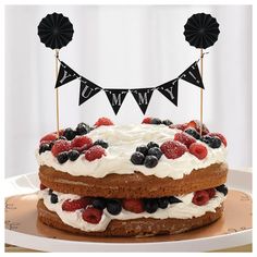 a cake with berries and blueberries on top