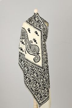 Elegant White Super soft wool Scarf, embroidered with Black and a touch of Silver traditional Kashmiri Paisley and Floral design with silk viscose yarn.   Highlights *Handmade in Kashmir  *Materials: Super Soft Wool, Embroided with Silk and viscose  *Length: 200 cm  *Width: 70 cm  Description Elegant and authentic Kashmiri scarf in super-soft wool-based White fabric, embroidered with Black and silver Silk viscose yarn.  Extremely comfortable to wear. Perfect for everyday or formal use.  This scarf is produced in a small family-owned business for the past five generations.  The colors of the scarf may differ slightly from those shown in the photos due to the light conditions and monitor calibration. Washing Instructions: Dry clean only. Please visit our online shop to find other beautiful P Traditional Winter Shawl With Floral Embroidery, Traditional Floral Embroidered Shawl For Winter, Traditional Embroidered Fabric With Motif, Traditional White Pashmina Shawl With Intricate Embroidery, Traditional Cream Pashmina Shawl, Traditional Embroidered Winter Shawl, Traditional Multicolor Embroidered Shawl For Winter, Traditional Cream Shawl With Intricate Embroidery, Embroidered Pashmina Shawl For Winter