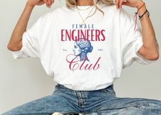 Women's Engineer T Shirt Proud Female Engineer Tee Gift for Women in STEM Engineering Graphic Shirt for Women Perfect for Women Engineers T CUSTOM DESIGN REQUESTS ARE WELCOME! MESSAGE ME 😊 𝑯𝑶𝑾 𝑻𝑶 𝑶𝑹𝑫𝑬𝑹 ✅ Choose color option ✅ Read size chart and select size ✅ Add to cart ✅ Check out and purchase item ✅ Shipping info provided via Etsy 𝑰𝑻𝑬𝑴 𝑰𝑵𝑭𝑶 😊 Comfort Colors 1717 T-Shirts 😊 Unisex Adult Sizing  😊 Direct to garment printing 😊 See listing for colors 😊 See listing for size chart  𝐘𝐨𝐮 𝐦𝐚𝐲 𝐚𝐥𝐬𝐨 𝐥𝐨𝐯𝐞... Custom Medal Holder https://www.etsy.com/listing/1657749048/personalized-medal-hanger-triathlon?click_key=5e0d038c27b408be6fcad0d0a1672b90d2e64812%3A1657749048&click_sum=62f35ded&ref=shop_home_feat_1 Customizable Transistion Towel! https://www.etsy.com/list Female Engineer, Stem Engineering, Women In Stem, Engineer Shirt, Tshirt Painting, Graphic Shirt, Shirt For Women, Triathlon, Gift For Women