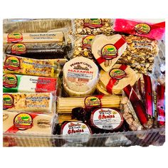 an assortment of cheeses, crackers, and other foods in a plastic container