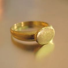 The Ring Made From 14 Karats Yellow Gold. Width Of The Signet: 0.35x0.43inch/ 9x11mm. Ring Width In The Wide Section: 0.15inch/ 4mm. In Figures 7 And 10 You Can See A Different Example Of A Signet Ring, Also In A White Gold. Signet Ring For Men. Signet Ring For Women. Unique And Special 14-Carat Gold Signet Ring. This Classy And Beautiful Ring Band Will Always Look Great. Delicate Signet Ring With A Flat Head A Classy And Unique Presence. Available In All Sizes, Color Gold, And Karat. Gold Dome Ring With Smooth Bezel In 14k Gold, Oval Dome Ring With Smooth Bezel For Formal Occasions, Heirloom White Gold Rings With Smooth Bezel, Heirloom White Gold Ring With Smooth Bezel, Classic Gold Dome Ring Of Recycled Gold, Modern Gold Signet Ring Stamped 14k, Luxury Yellow Gold Signet Ring With Smooth Bezel, Luxury Oval Rings With Smooth Bezel, Luxury Oval Ring With Smooth Bezel