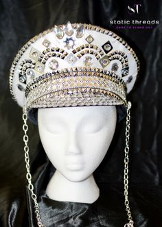 This White and Silver Festival Hat is made with extreme detail and patience. It has a white shimmery fabric and intricate silver embellishments like studs, mirrors, and rhinestones a silver metal chain to hang down. You can also Request your custom order by messaging me on Facebook.com/staticthreads or click the message us at the bottom right corner of the screen. Let me know the colors or theme you would like or an outfit you'd like to match! This Military Hat is a size Large that measures 22-2 Queen Raina, Burning Man Accessories, Rave Hats, Festival Hats, Diy Hats, Hat Burning, Silver Hat, Mario E Luigi, Silver Hats