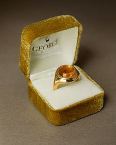 A golden-hued natural citrine cabochon sits snugly inside a warm rim of gold. Inspired by rings of antiquity, we chose tone-on-tone for The Monarch — the spectrum of rich yellows offers a reassuring glow that deepens with time and wear. Of special note: the underside of The Monarch is made of solid gold — no exposed gemstones or hollow curves; just a continuous circle of gold around your finger. This detail will, of course, only really be known by you, the wearer. No apologies though, The Monarc Heirloom Rings, No Apologies, Luxury Jewelry Brands, The Monarch, Gold Gemstone Ring, Natural Citrine, Men's Rings, Jewelry Branding, Luxury Jewelry