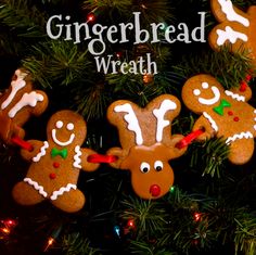 some gingerbread cookies are hanging from a christmas tree with the words gingerbread wreath on it